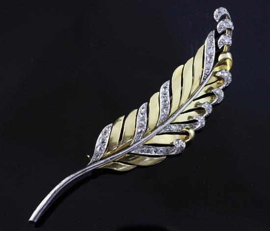 An 18ct gold, platinum and diamond set leaf brooch, 3.25in.